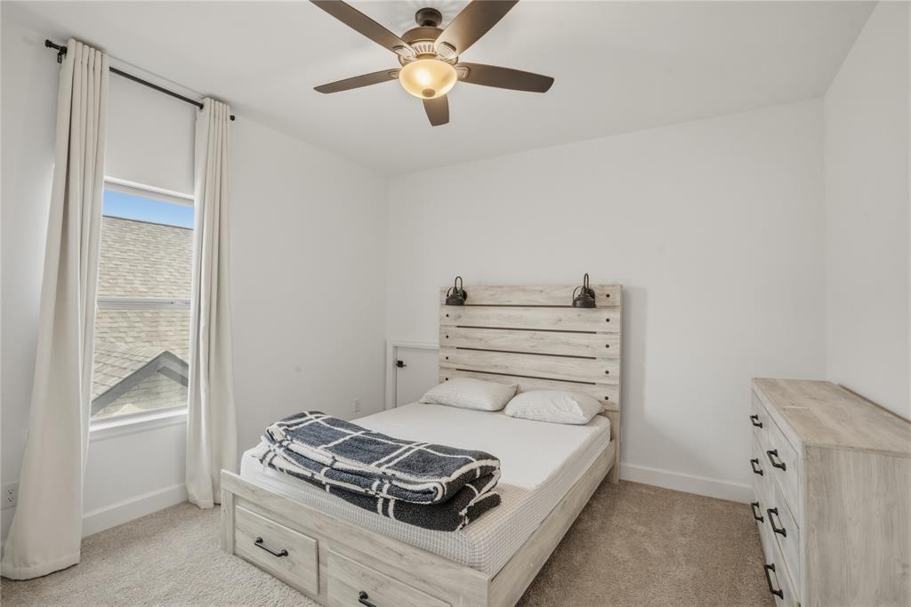 908 Maple Leaf Lane Haslet, TX 76052 - Photo 29 of 40 a bedroom with a bed and a window