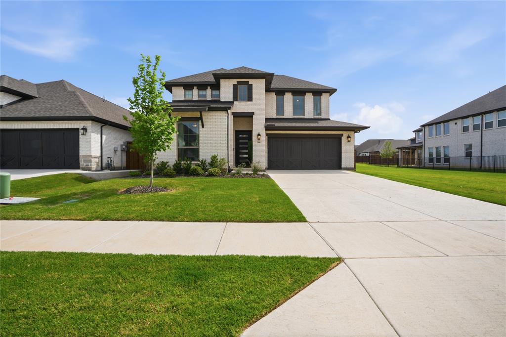 908 Maple Leaf Lane Haslet, TX 76052 - Photo 3 of 40 a front view of a house with a yard and garage