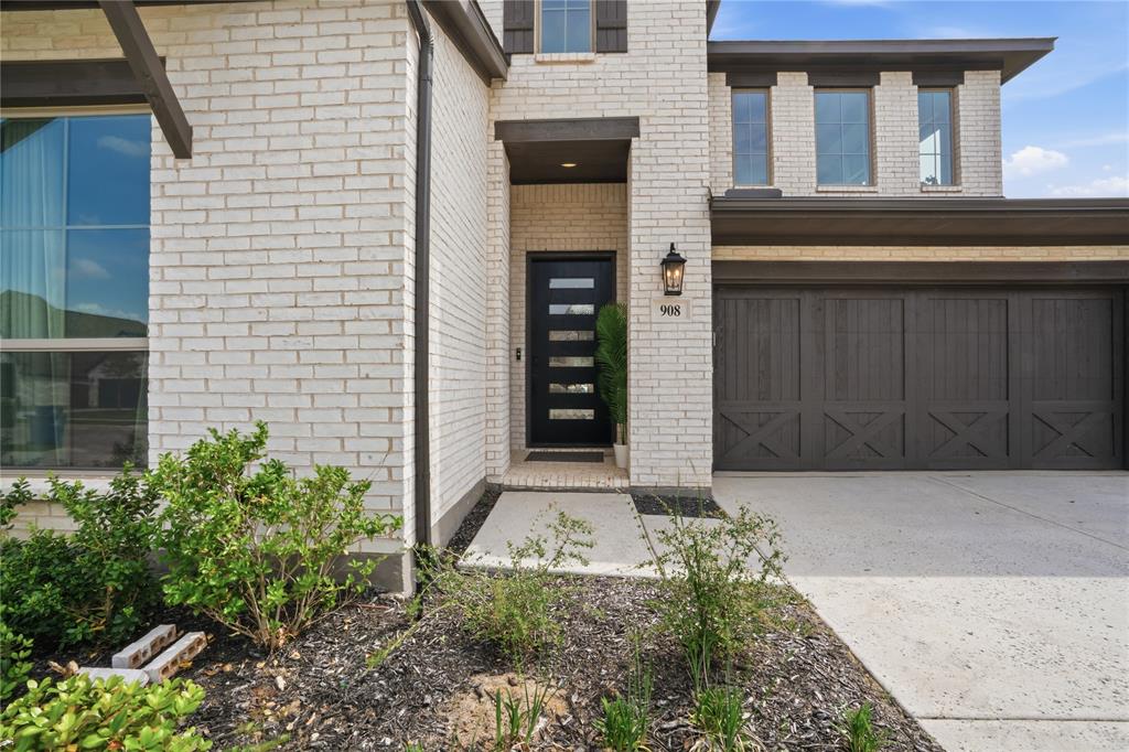 908 Maple Leaf Lane Haslet, TX 76052 - Photo 4 of 40 front view of a house with a window and potted plants