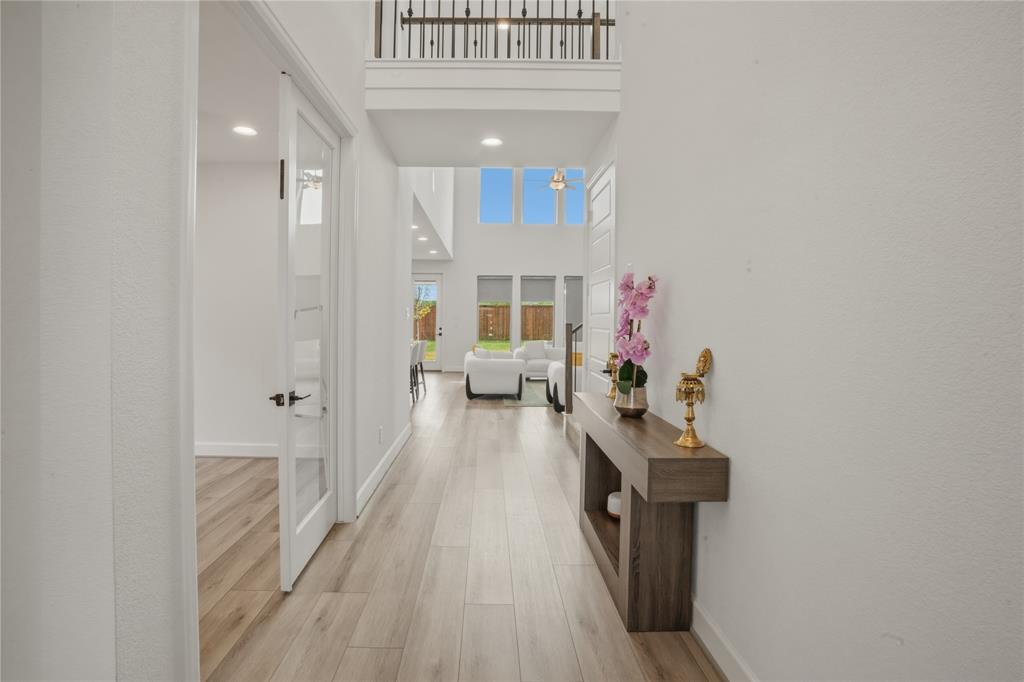 908 Maple Leaf Lane Haslet, TX 76052 - Photo 5 of 40 a very nice looking room with a wooden floor