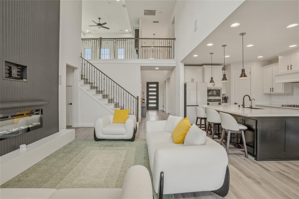908 Maple Leaf Lane Haslet, TX 76052 - Photo 9 of 40 a living room with furniture and a flat screen tv