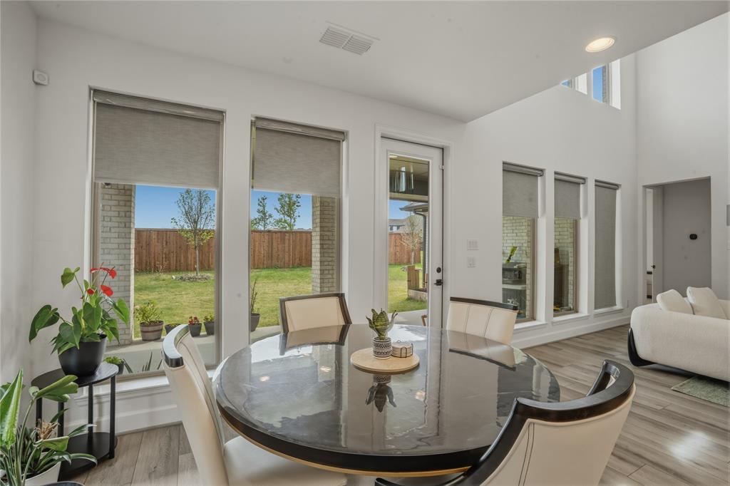 908 Maple Leaf Lane Haslet, TX 76052 - Photo 10 of 40 a dining room with furniture and wooden floor