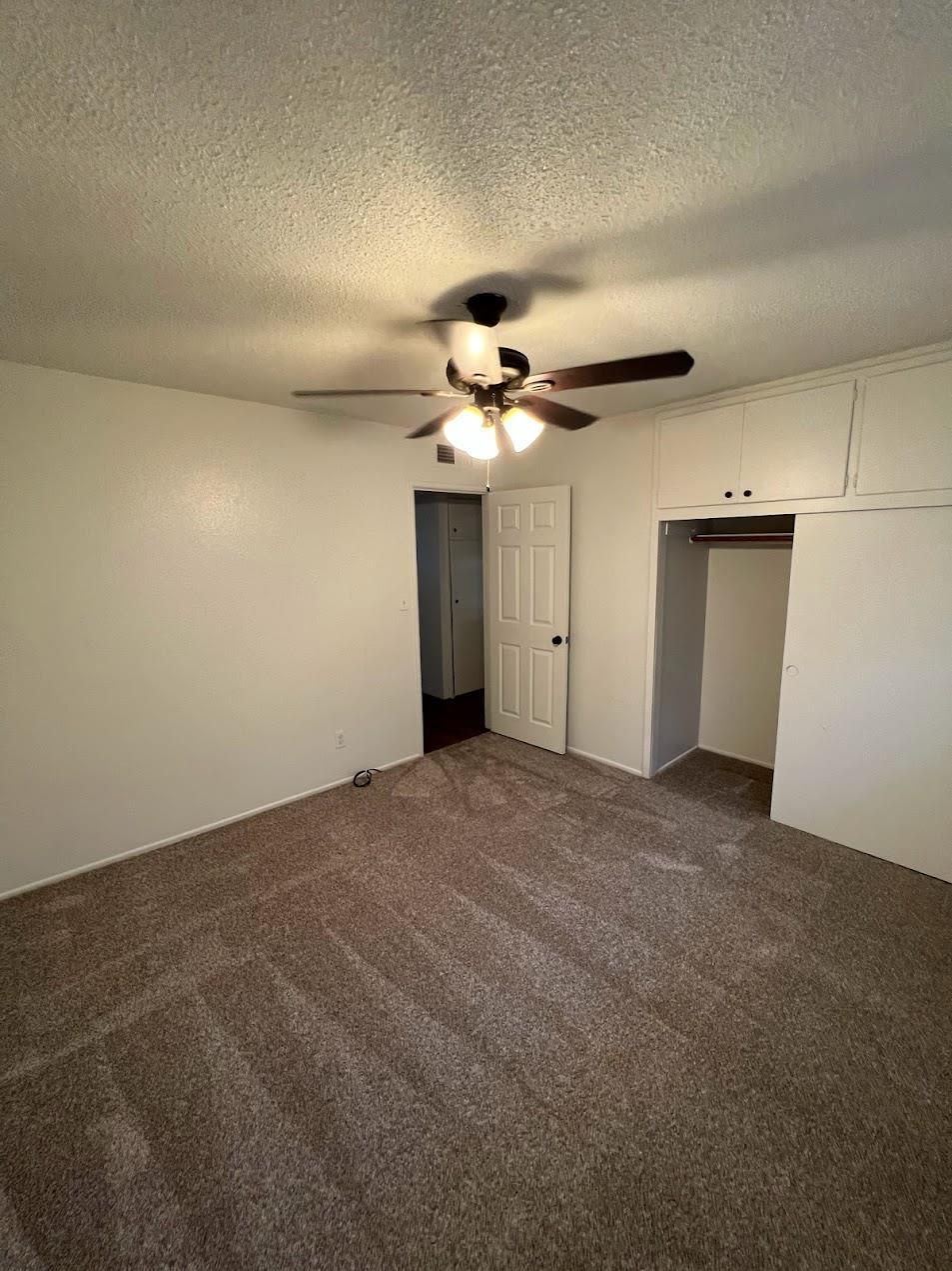 1205 F Street Reedley, CA 93654 - Photo 14 of 33 a view of a livingroom with a ceiling fan
