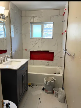 a bathroom with a sink and a bathtub
