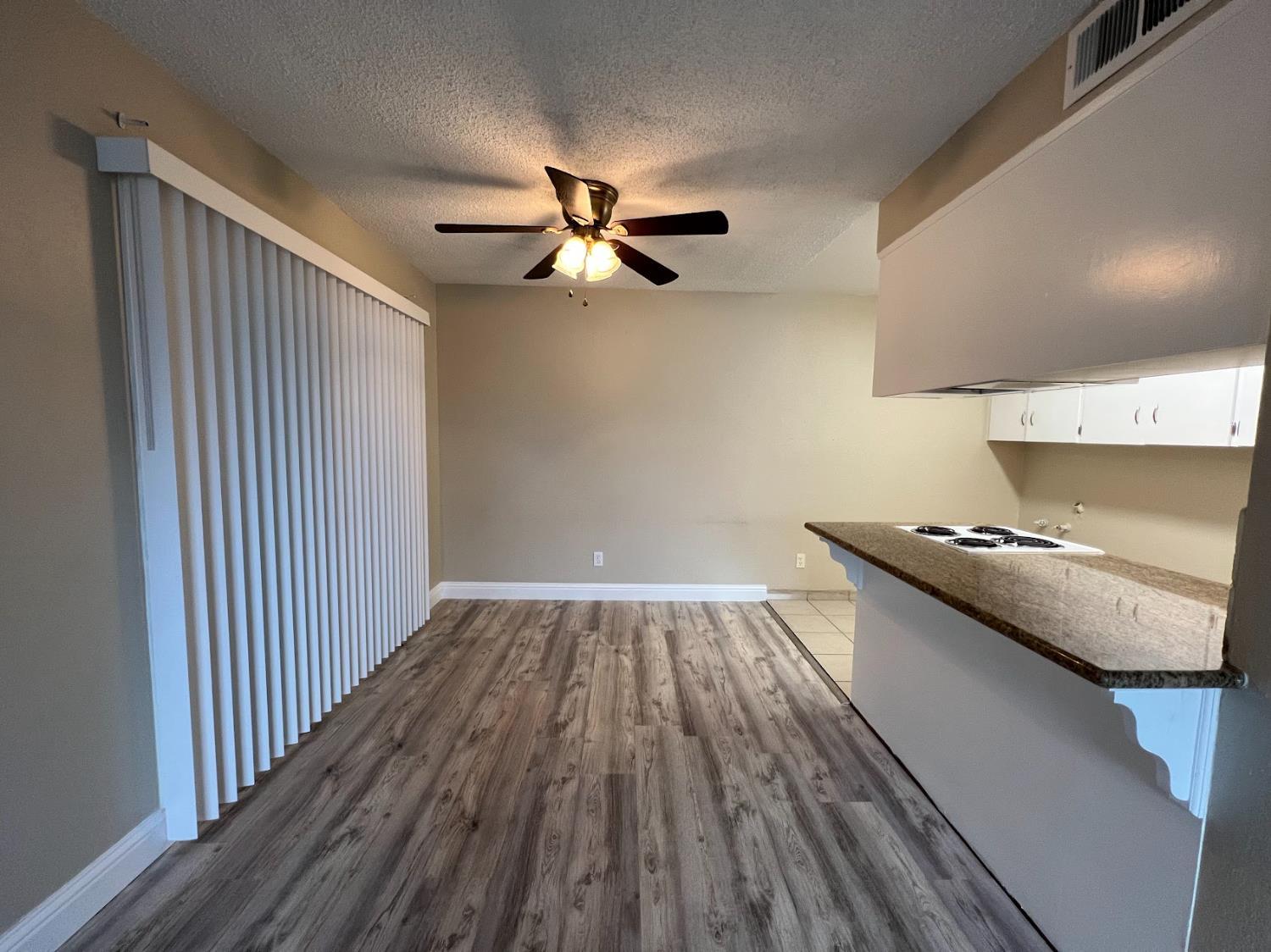 1205 F Street Reedley, CA 93654 - Photo 20 of 33 a view of a livingroom with wooden floor