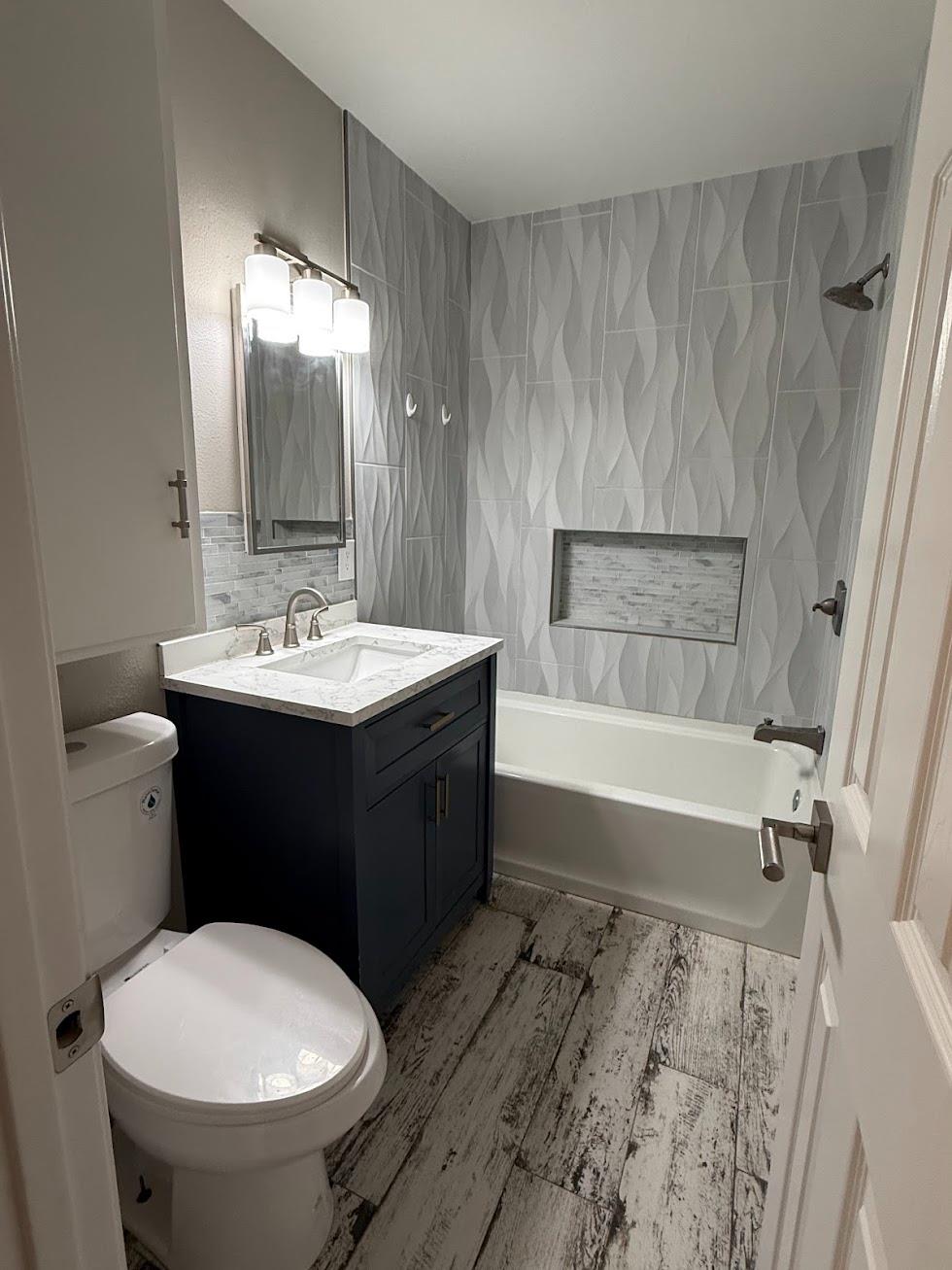 1205 F Street Reedley, CA 93654 - Photo 26 of 33 a bathroom with a sink and a mirror