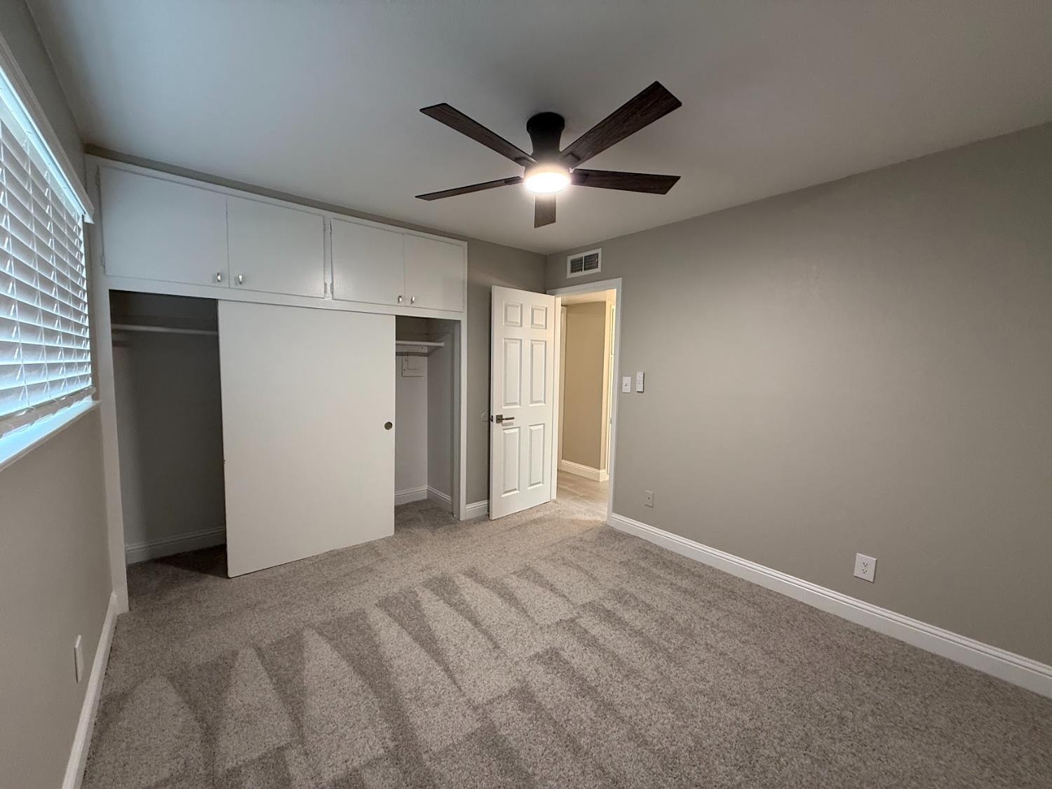 1205 F Street Reedley, CA 93654 - Photo 29 of 33 a view of an empty room with a ceiling fan