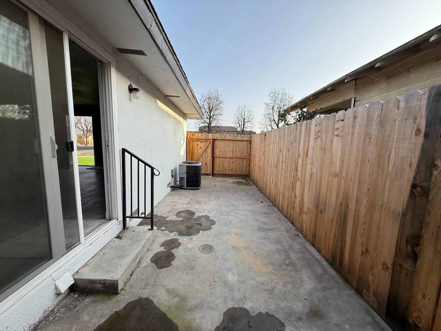 1205 F Street Reedley, CA 93654 - Photo 31 of 33 a view of a porch with wooden floor and stairs