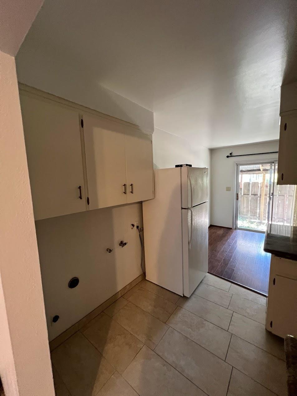 1205 F Street Reedley, CA 93654 - Photo 8 of 33 a view of kitchen with furniture and refrigerator