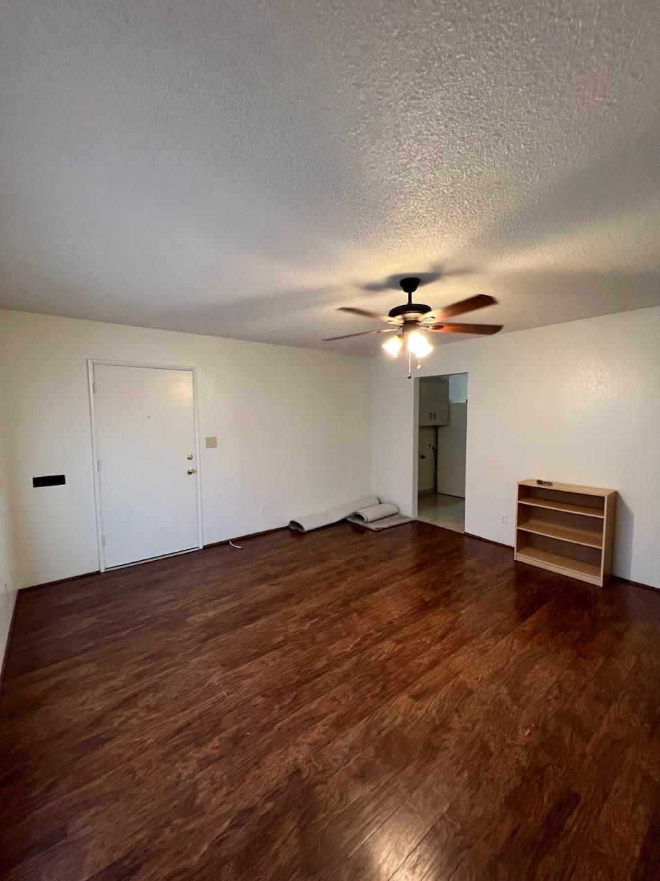 1205 F Street Reedley, CA 93654 - Photo 9 of 33 a view of empty room with wooden floor
