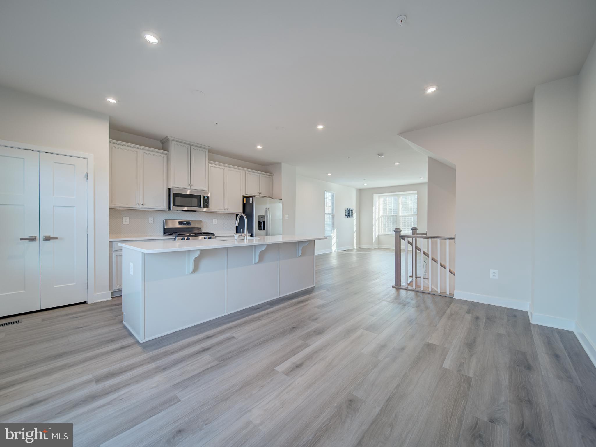 9502 Autumn Berry Place Montgomery Village, MD 20886 - Photo 17 of 36 a view of kitchen with cabinets microwave and stove