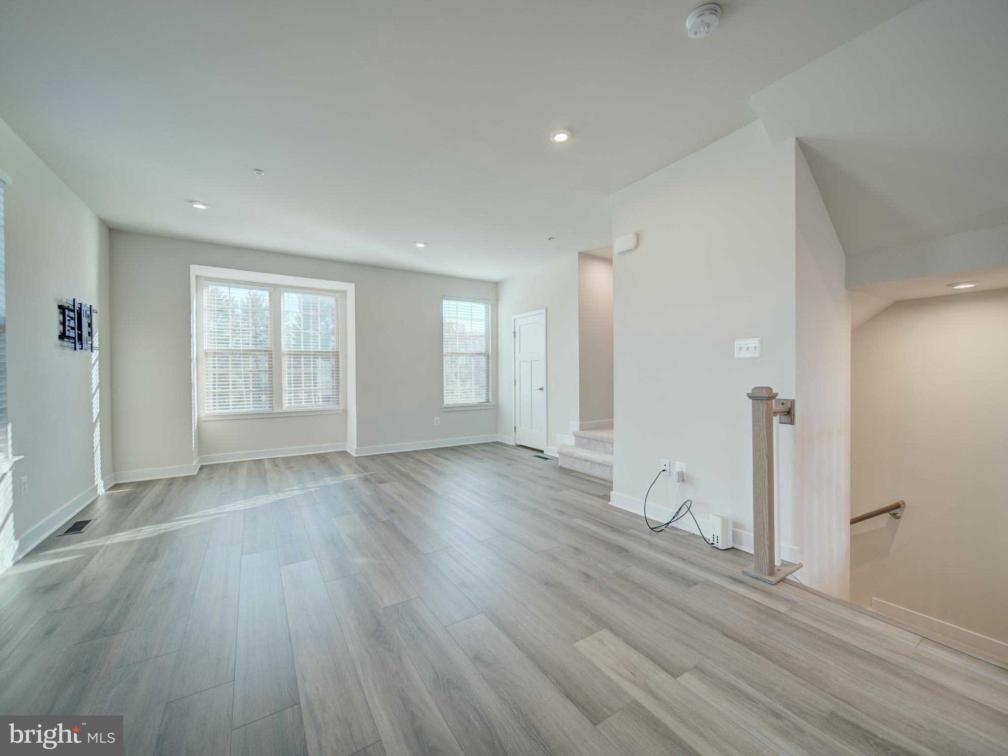 9502 Autumn Berry Place Montgomery Village, MD 20886 - Photo 18 of 36 wooden floor in an empty room with a window