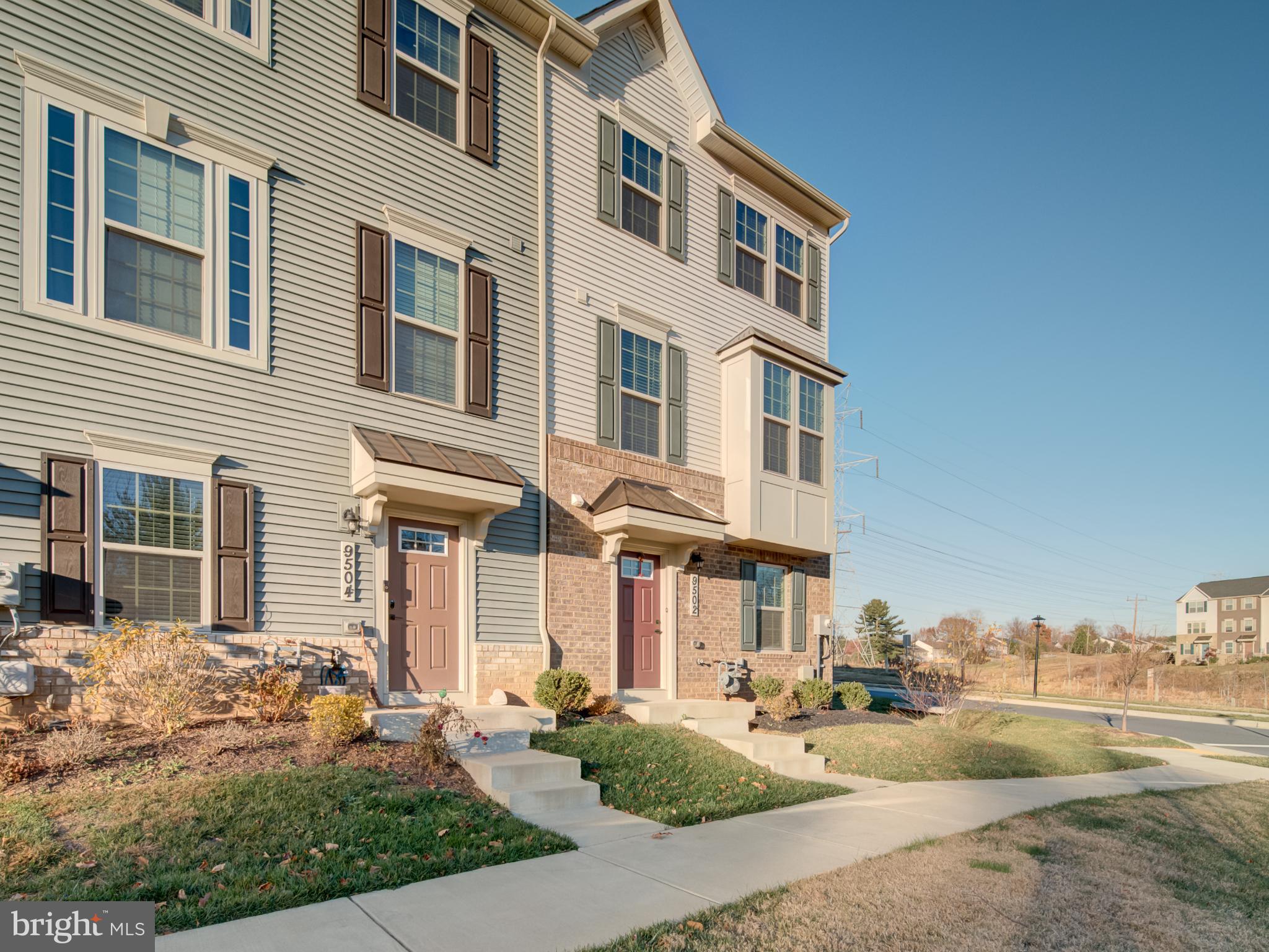 9502 Autumn Berry Place Montgomery Village, MD 20886 - Photo 3 of 36 a front view of a house with a yard