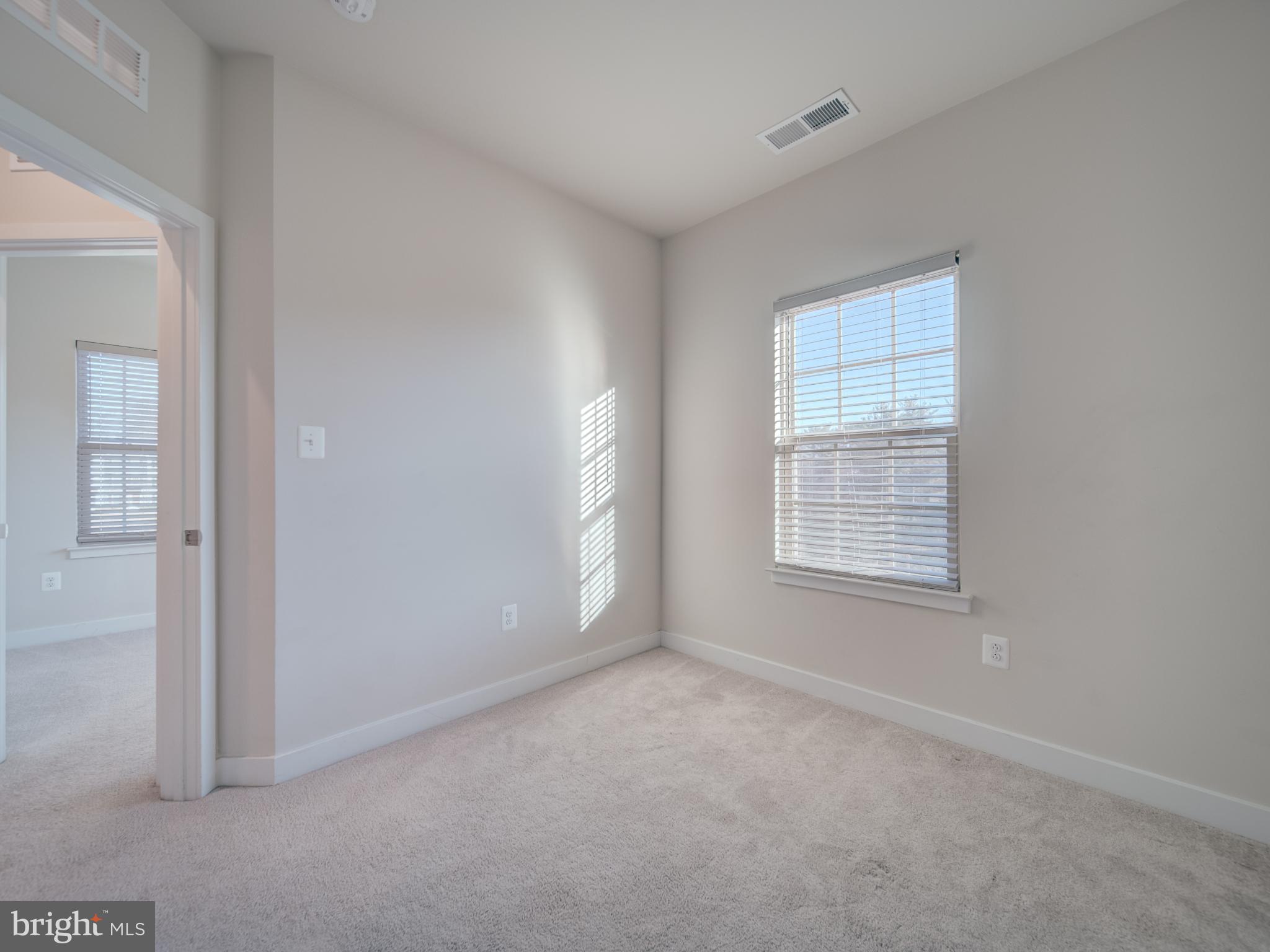 9502 Autumn Berry Place Montgomery Village, MD 20886 - Photo 33 of 36 an empty room with windows