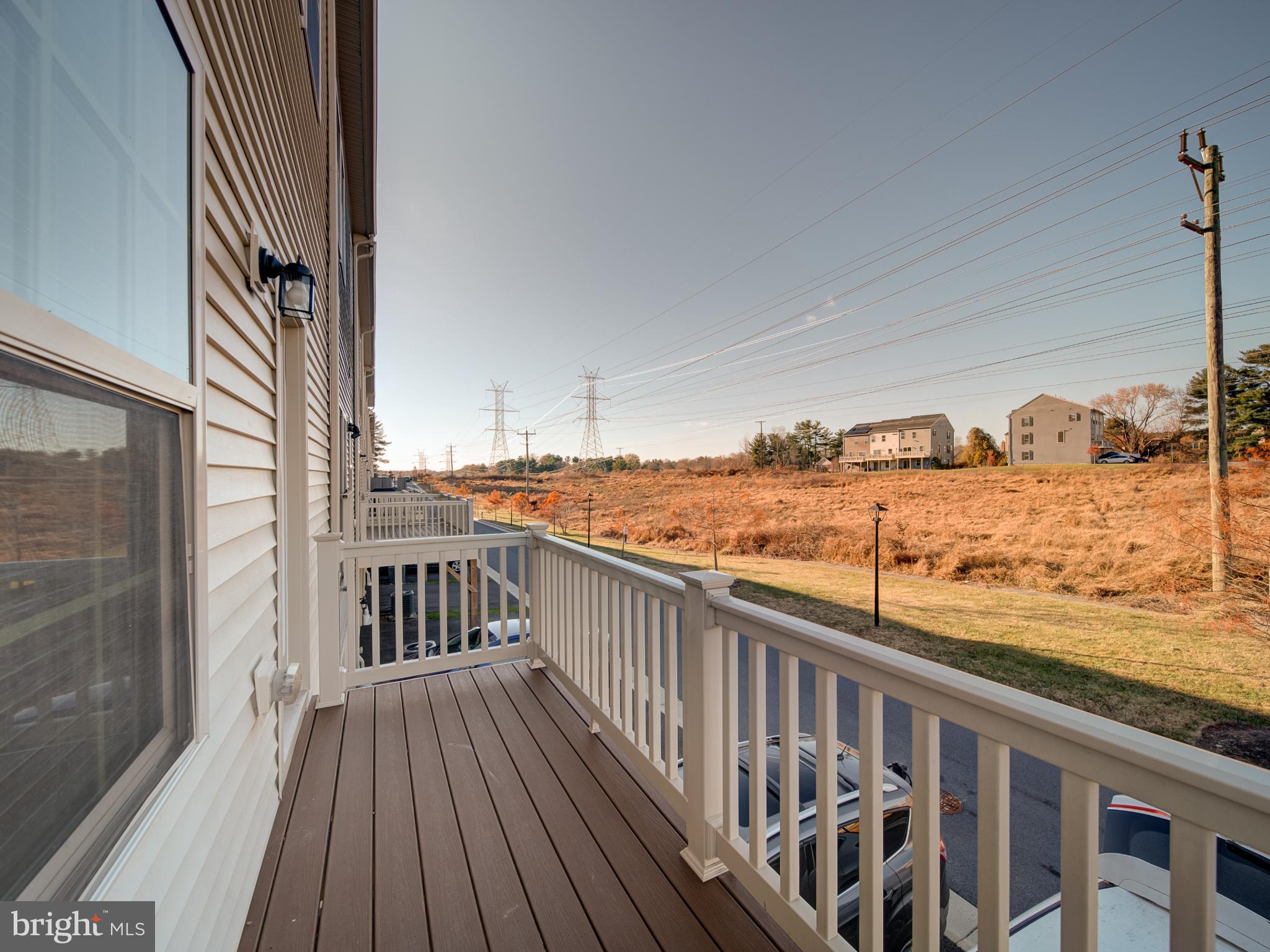 9502 Autumn Berry Place Montgomery Village, MD 20886 - Photo 34 of 36 a view of a balcony with wooden floor
