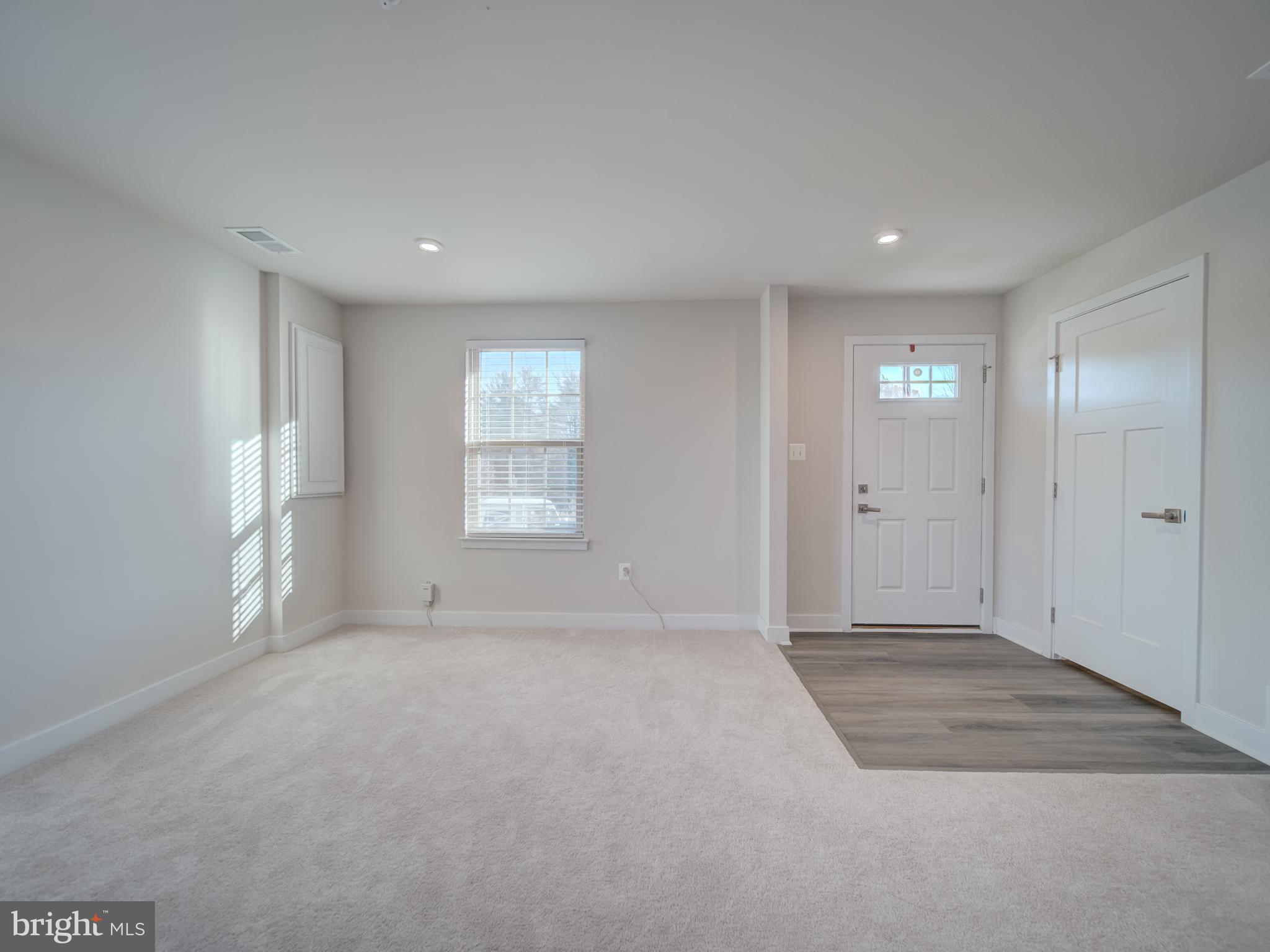 9502 Autumn Berry Place Montgomery Village, MD 20886 - Photo 5 of 36 wooden floor in an empty room with a window