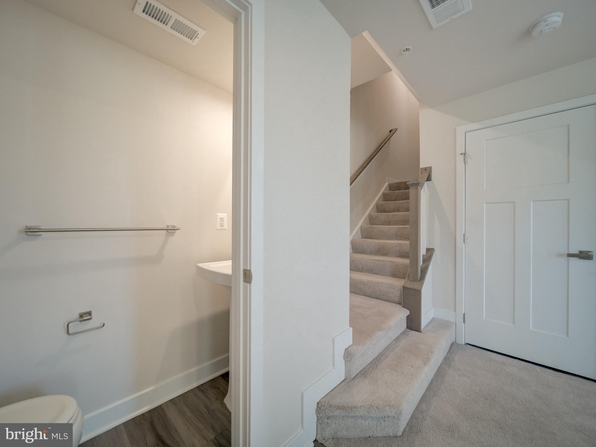 9502 Autumn Berry Place Montgomery Village, MD 20886 - Photo 6 of 36 a view of room with stairs and a toilet
