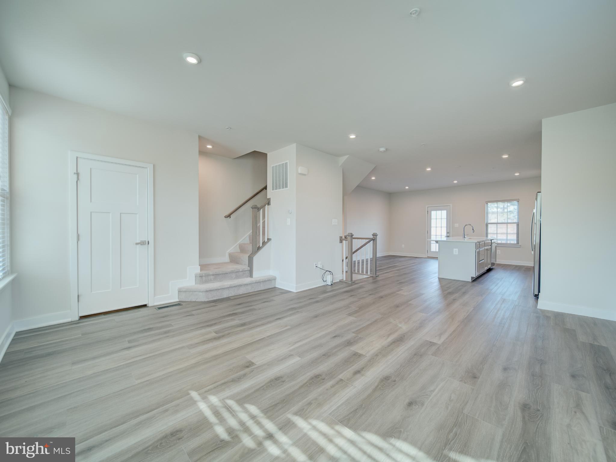 9502 Autumn Berry Place Montgomery Village, MD 20886 - Photo 10 of 36 a view of empty room with wooden floor