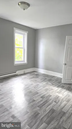 a kitchen with stainless steel appliances granite countertop a sink stove and wooden floor