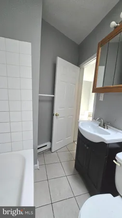 a bathroom with a bathtub and a sink
