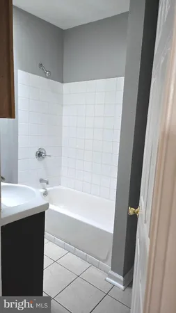 a view of an empty room and wooden floor