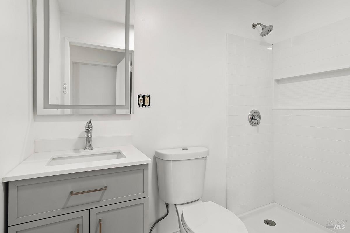 523 B Street San Rafael, CA 94901 - Photo 31 of 37 a bathroom with a sink a toilet and shower
