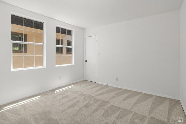a view of empty room with windows