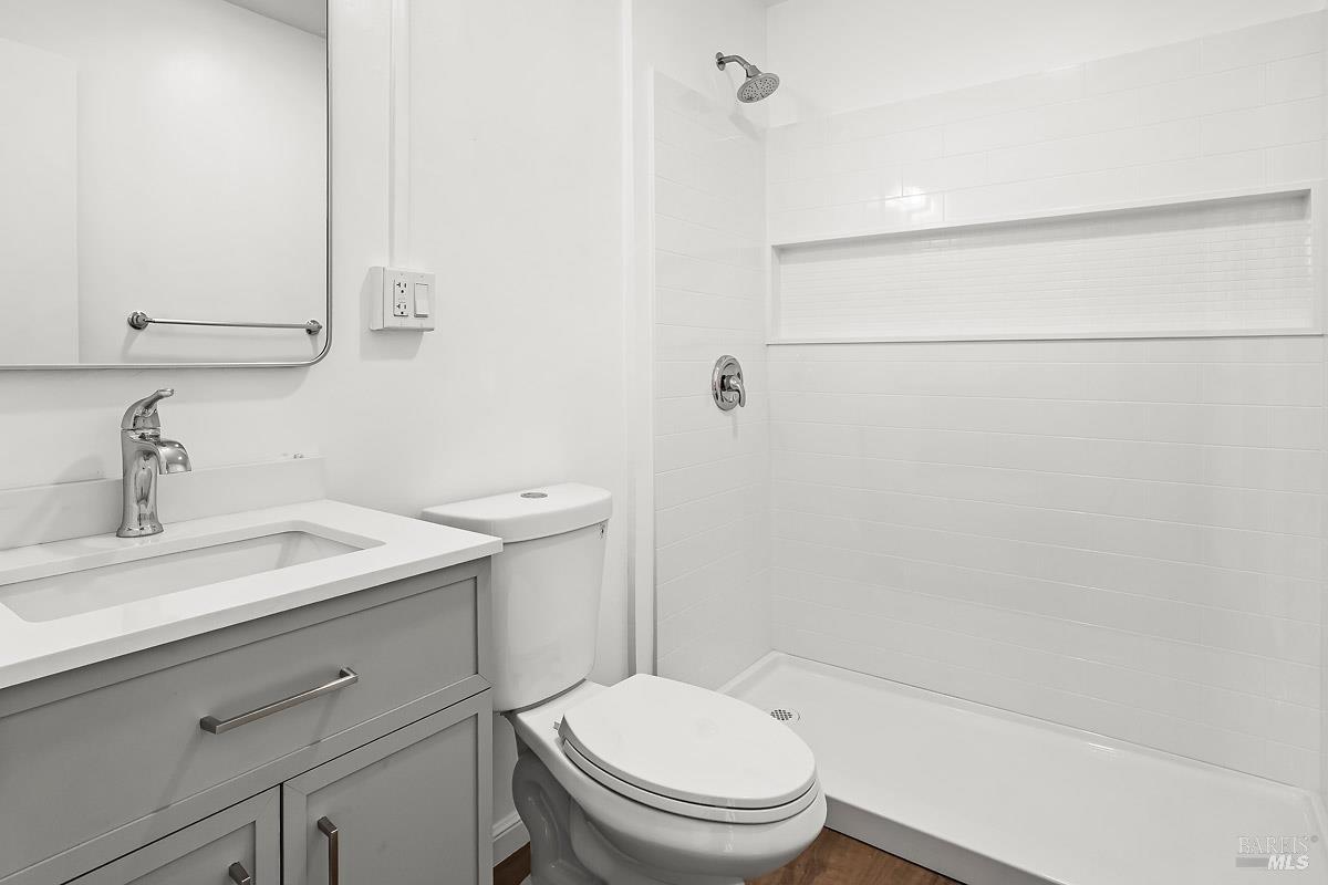 523 B Street San Rafael, CA 94901 - Photo 10 of 37 a bathroom with a sink a toilet and shower