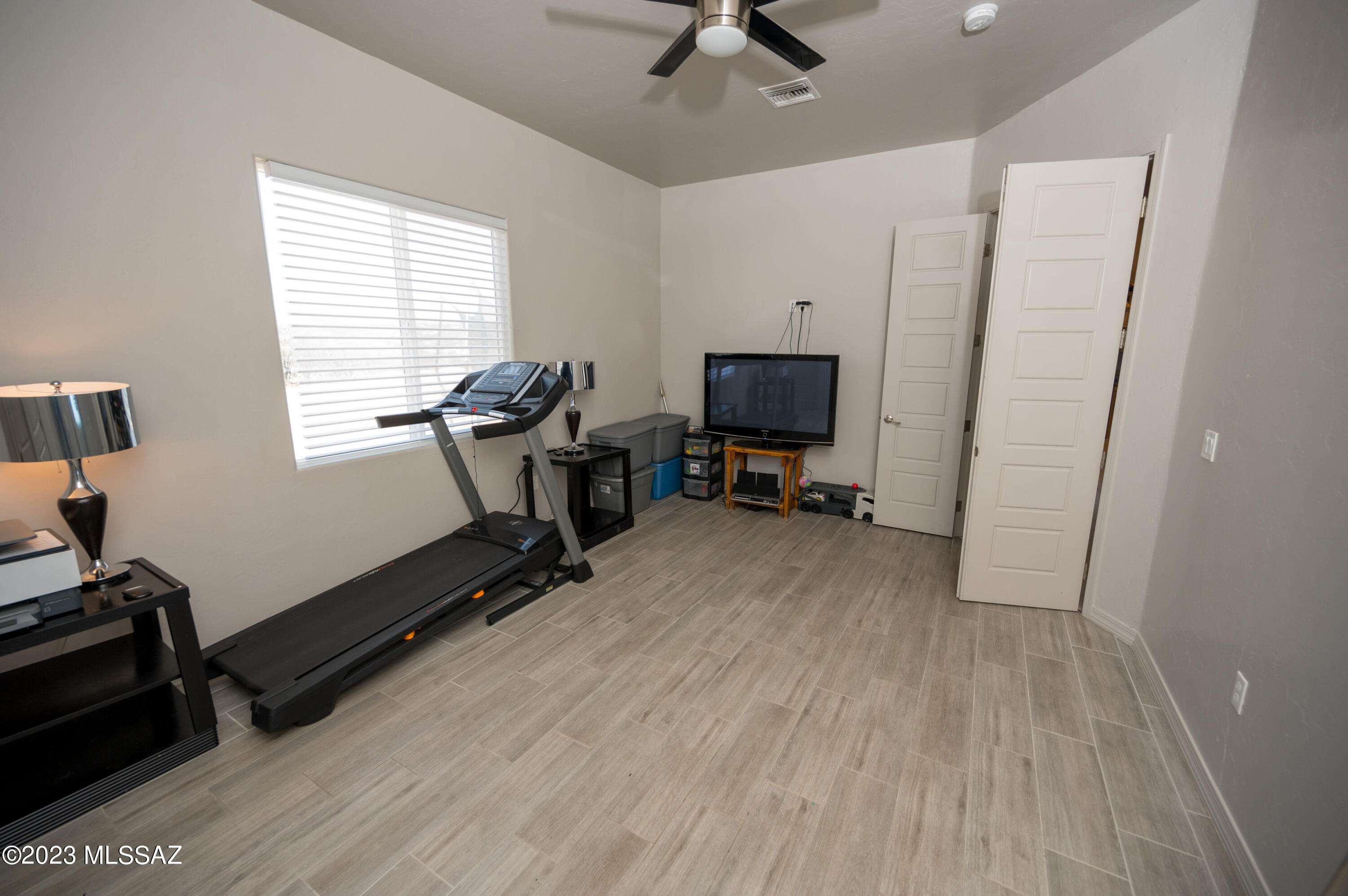 384 Via Estrella Vista Rio Rico, AZ 85648 - Photo 18 of 32 a view of a workspace with furniture and a window
