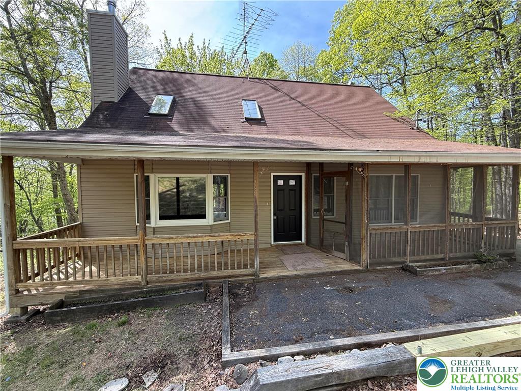 184 Doe Loop Bushkill, PA 18324 - Photo 1 of 18 a front view of a house with a yard