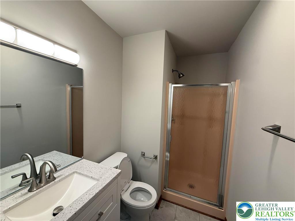 184 Doe Loop Bushkill, PA 18324 - Photo 14 of 18 a bathroom with a sink a toilet and shower