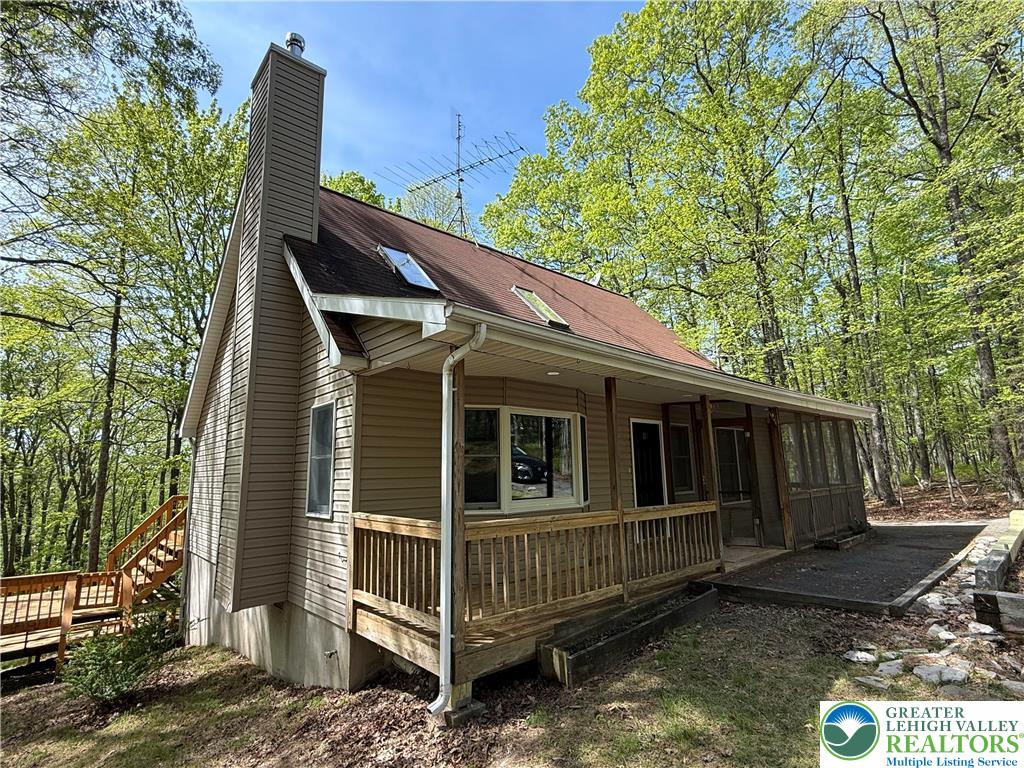 184 Doe Loop Bushkill, PA 18324 - Photo 2 of 18 a view of a house with a yard and wooden fence