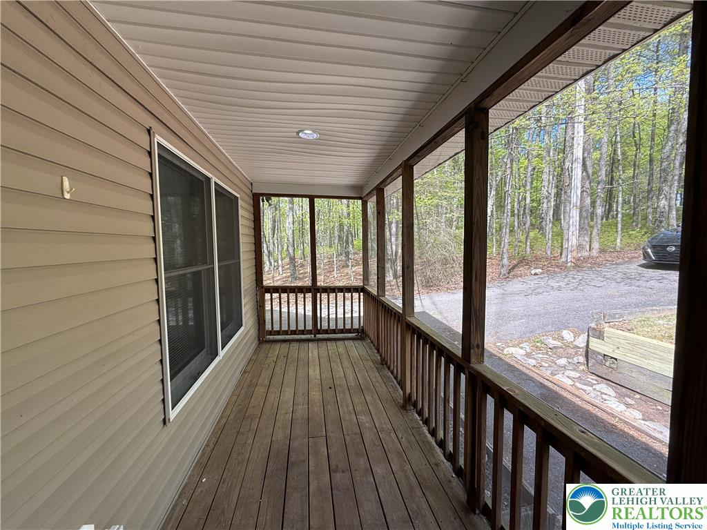 184 Doe Loop Bushkill, PA 18324 - Photo 5 of 18 a view of a balcony with wooden floor