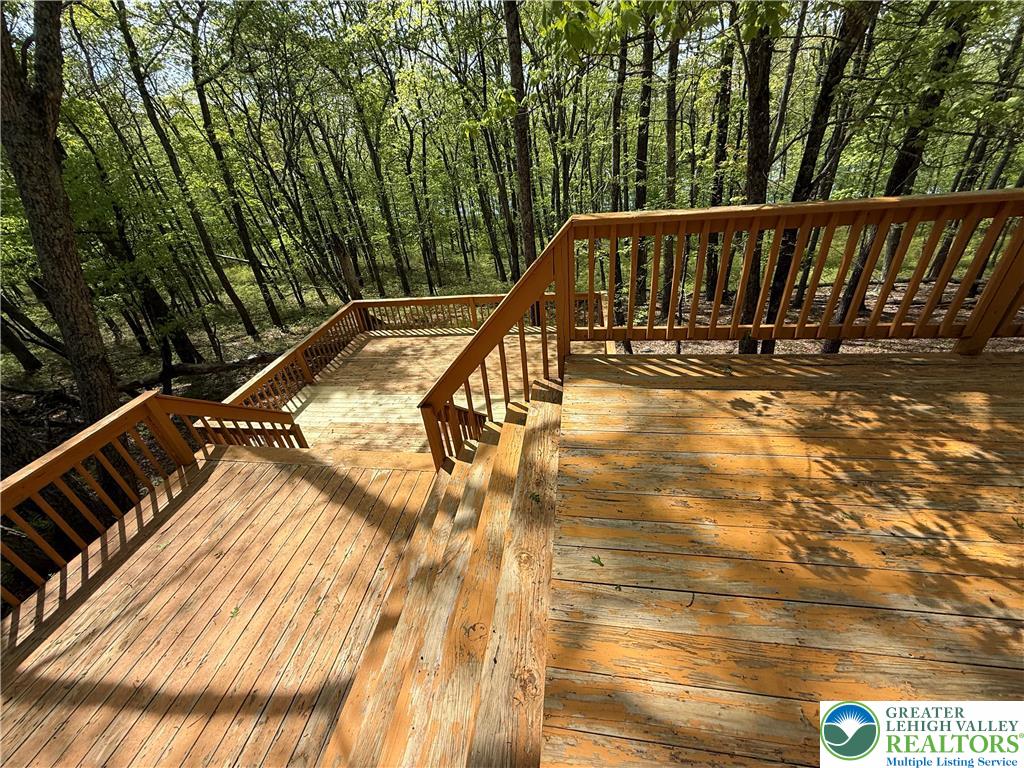 184 Doe Loop Bushkill, PA 18324 - Photo 9 of 18 a view of balcony with wooden floor