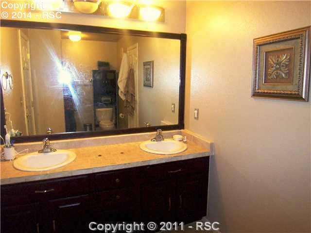 1605 Monterey Road, Unit A Colorado Springs, CO 80910 - Photo 12 of 16 Large Jack & Jill Bathroom with tiled Double Vanity