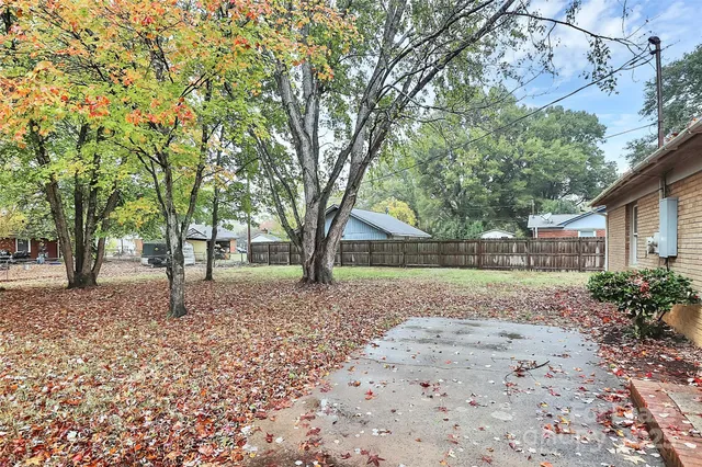 a view of a yard with a tree