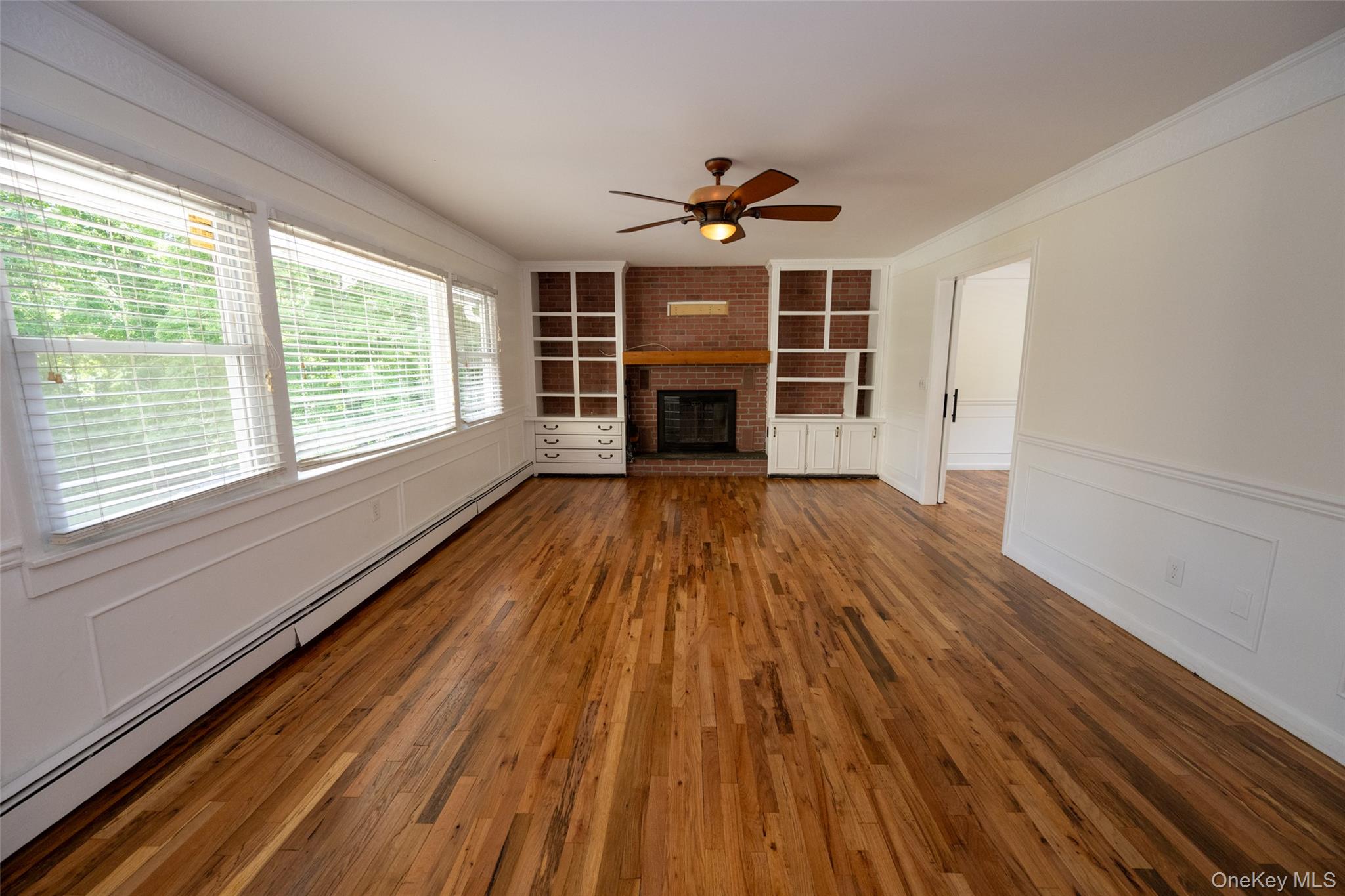 136 Foggintown Road Brewster, NY 10509 - Photo 18 of 50 a view of wooden floor wooden cabinets and windows in a room