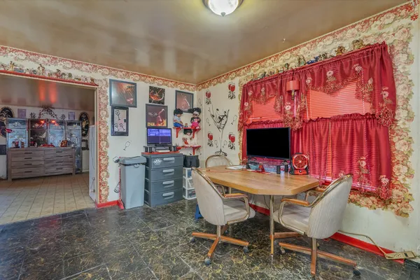 a view of a dining room with furniture and window