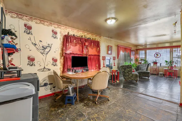 a view of a livingroom with furniture and a window