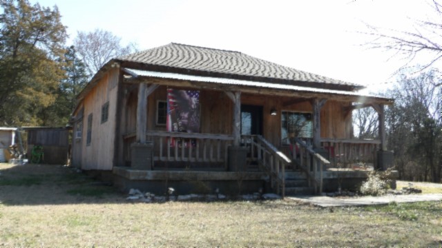 1586 Needmore Road Old Hickory, TN 37138 - Photo 17 of 45 a view of a house with a small yard and wooden fence