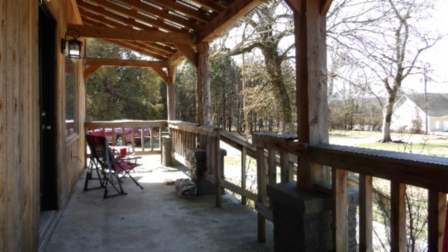 1586 Needmore Road Old Hickory, TN 37138 - Photo 19 of 45 a view of a porch with chairs and backyard