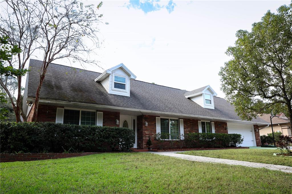 6707 Drifting Sands Road Temple Terrace, FL 33617 - Photo 1 of 1 a front view of a house with a yard