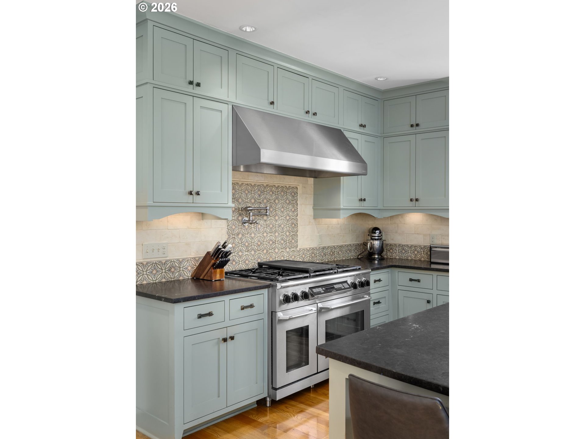 1030 Southeast 58th Place Portland, OR 97215 - Photo 12 of 48 a kitchen with cabinets and stainless steel appliances