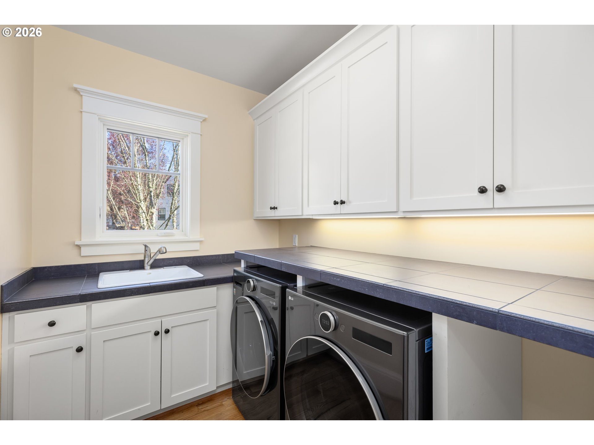 1030 Southeast 58th Place Portland, OR 97215 - Photo 27 of 48 a utility room with cabinets