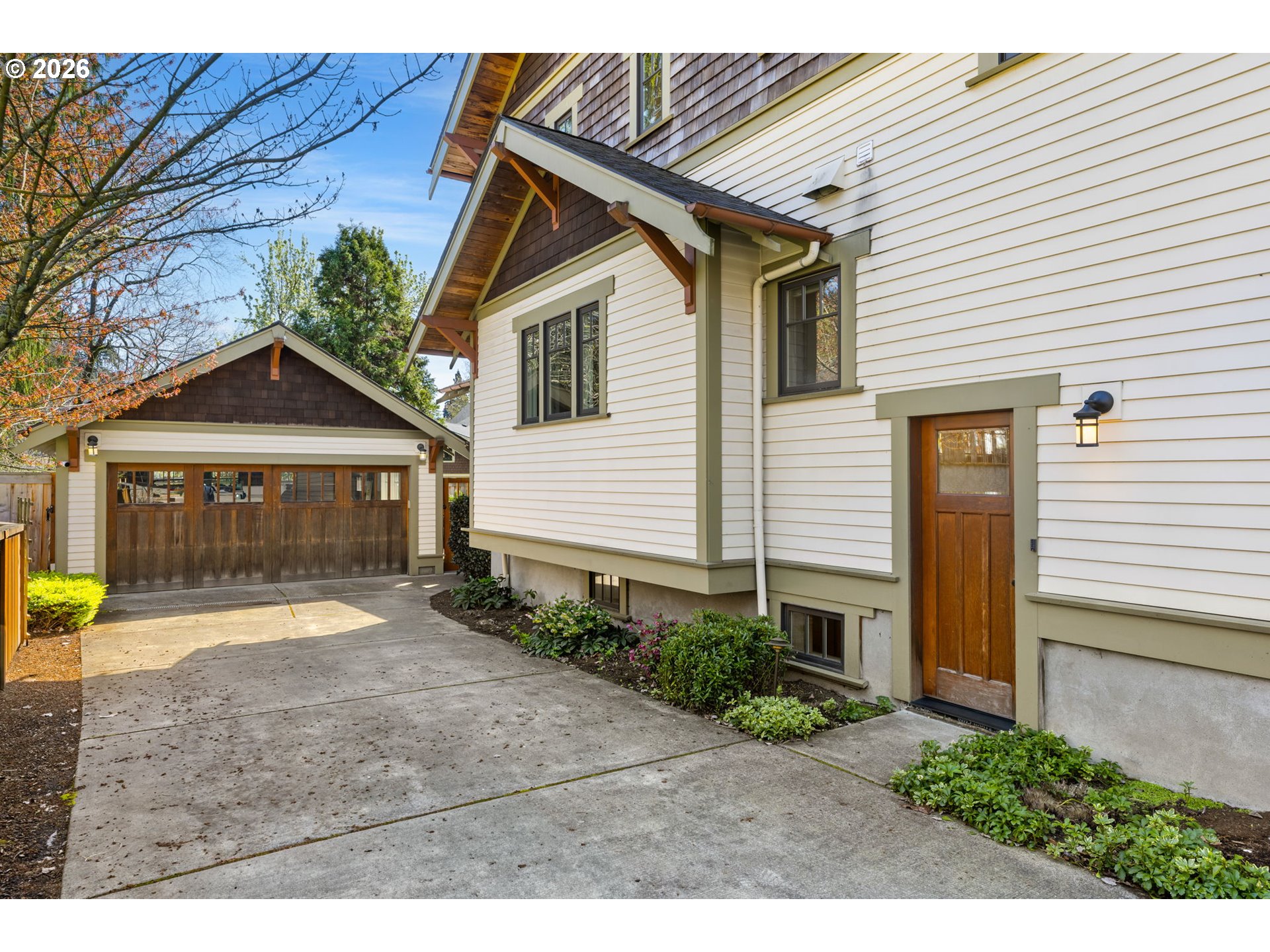 1030 Southeast 58th Place Portland, OR 97215 - Photo 41 of 48 a front view of a house with a yard and potted plants
