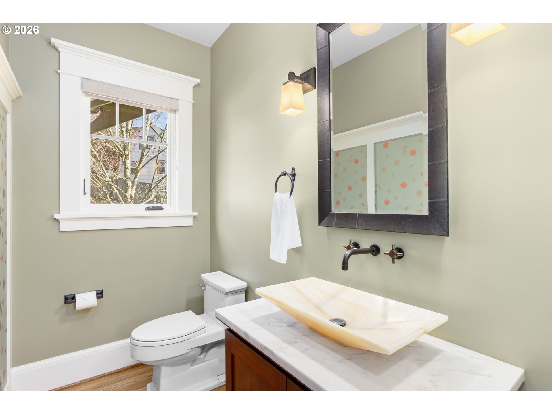 1030 Southeast 58th Place Portland, OR 97215 - Photo 9 of 48 a bathroom with a toilet a sink and mirror
