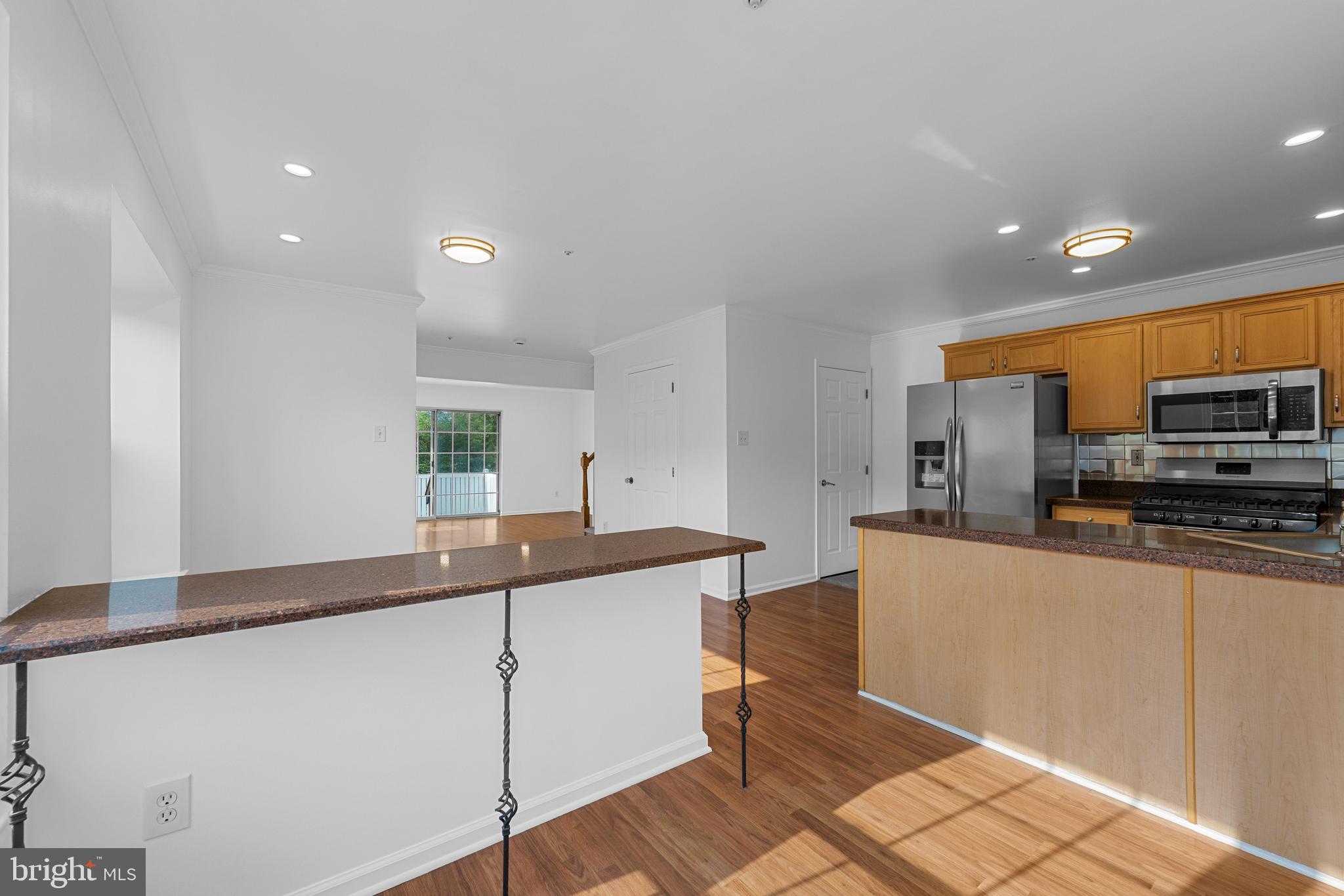 540 Eagle Court Jamison, PA 18929 - Photo 11 of 32 a kitchen with stainless steel appliances granite countertop a sink and a refrigerator