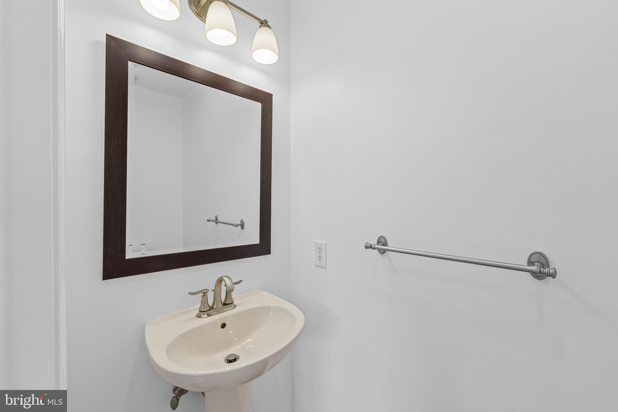 540 Eagle Court Jamison, PA 18929 - Photo 12 of 32 a bathroom with a sink and a mirror