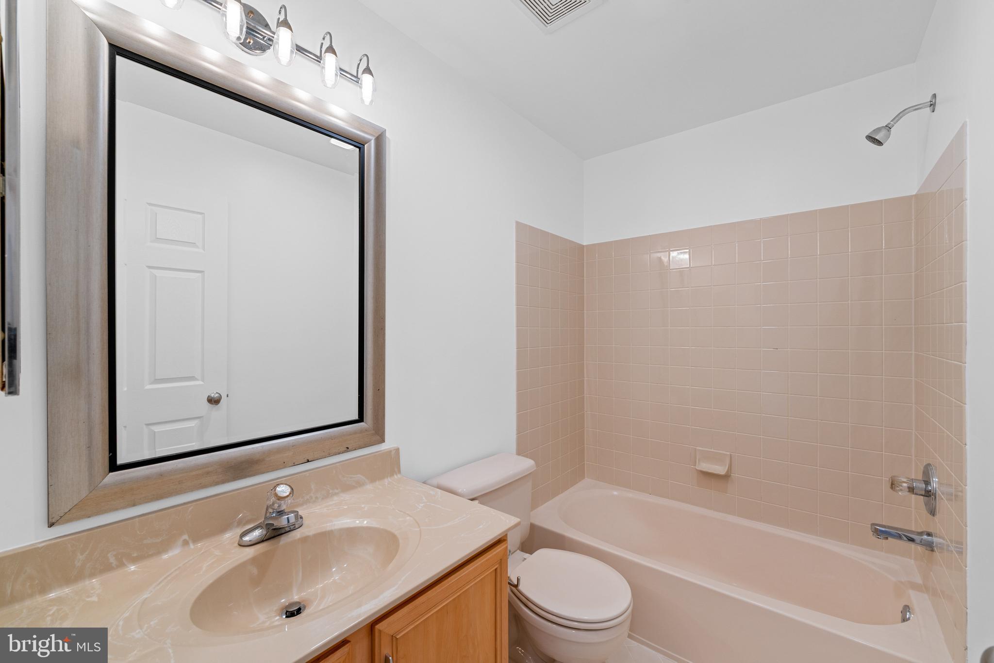 540 Eagle Court Jamison, PA 18929 - Photo 15 of 32 a bathroom with a bathtub shower sink vanity and toilet