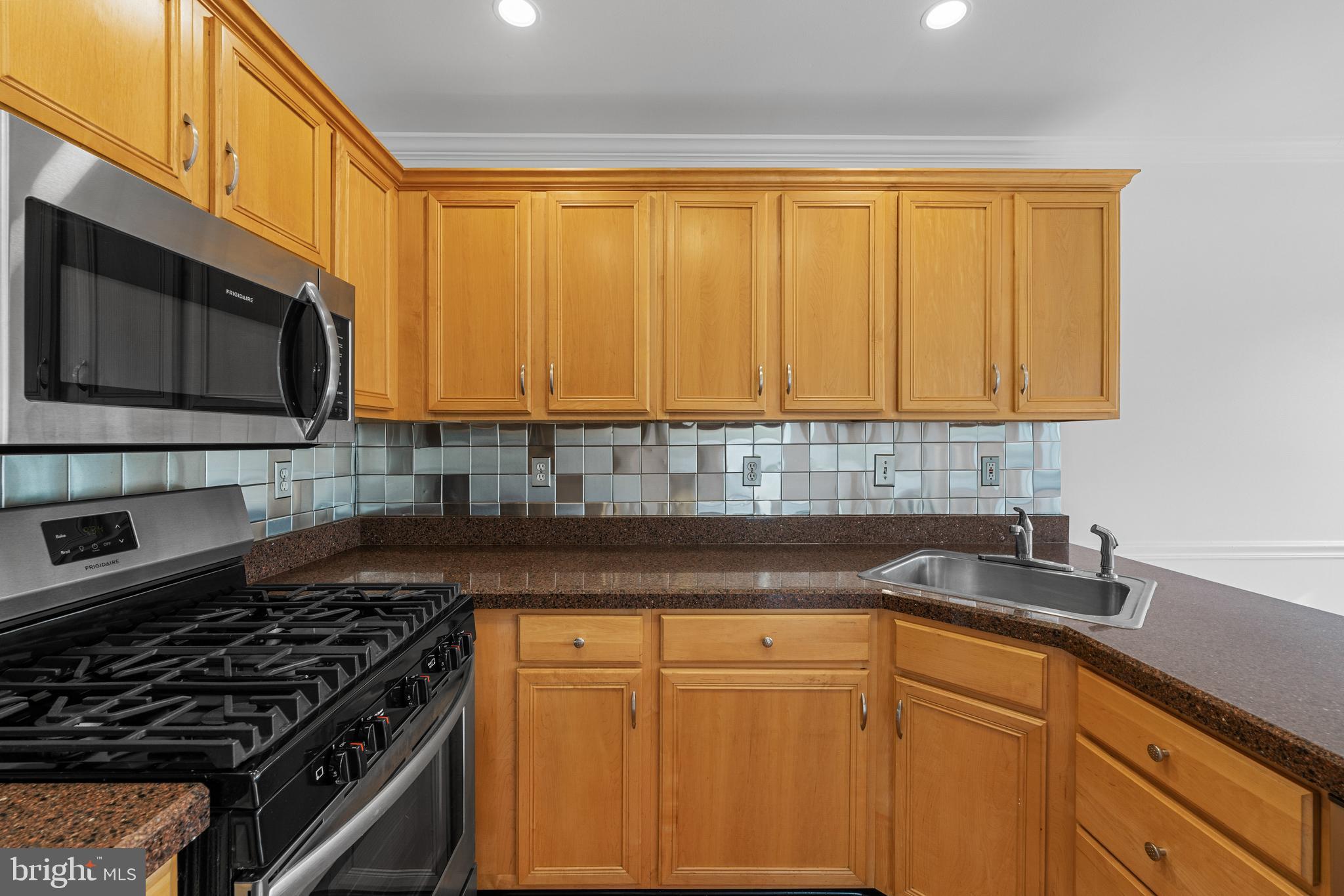 540 Eagle Court Jamison, PA 18929 - Photo 6 of 32 a kitchen with granite countertop cabinets stainless steel appliances a sink and a counter space